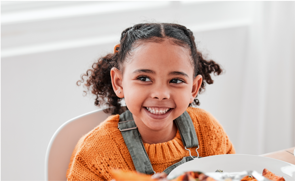 Young girl smiling at camera