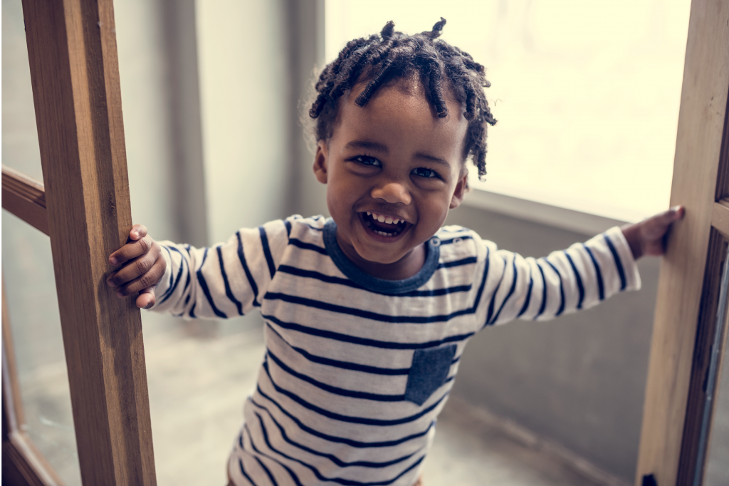 toddler smiling at camera