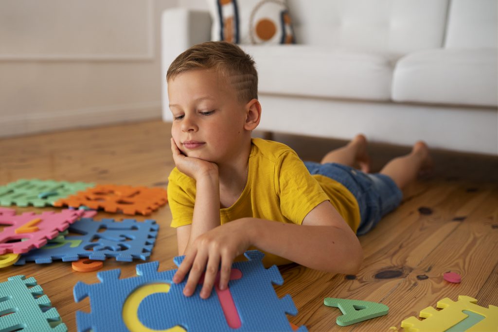Boy playing with brain teaser toys