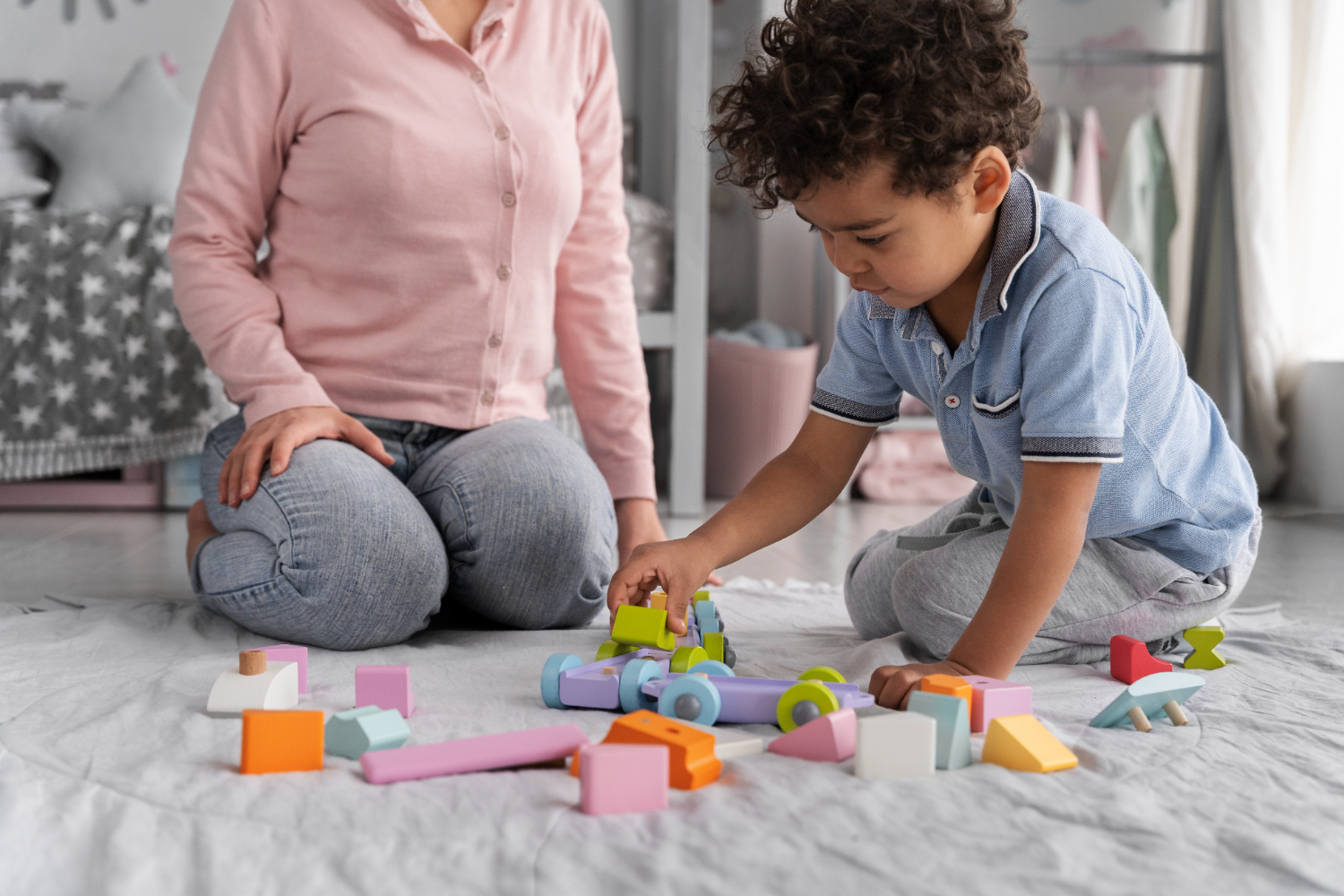 child building a train with blocks