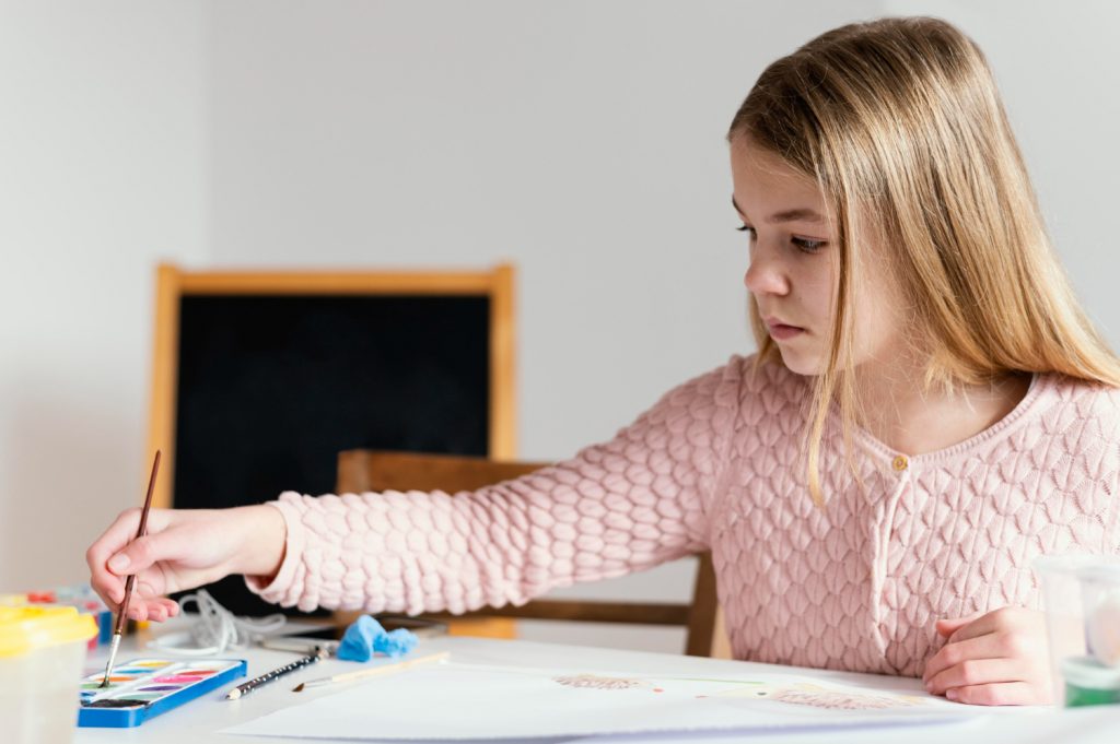 Girl painting a picture