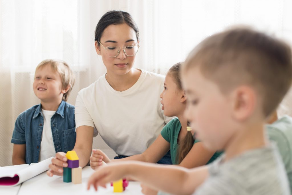 Group of kids working with tutor