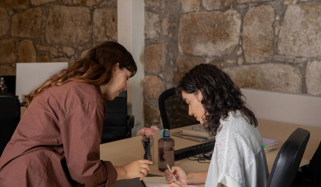 Two women in office