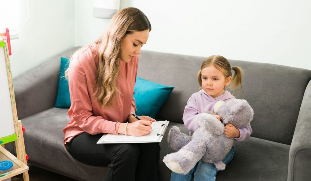 Child in therapy with teddy