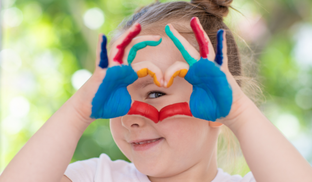 painted hands making heart shape
