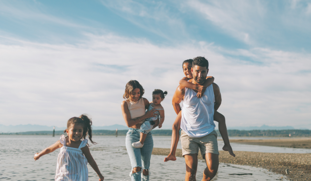 Family playing on the beach
