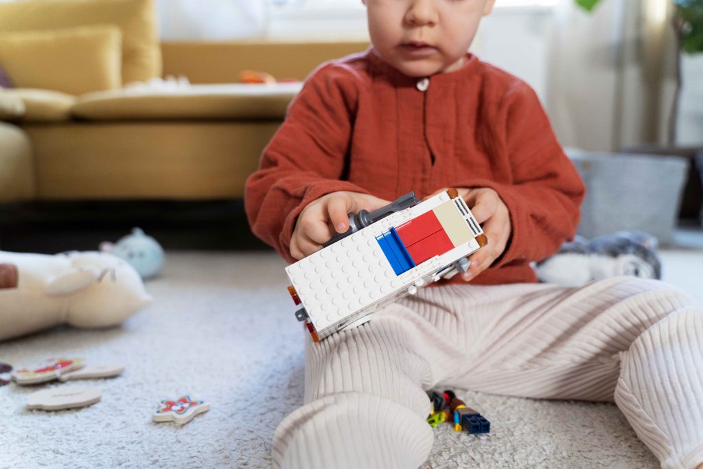 Boy playing with block