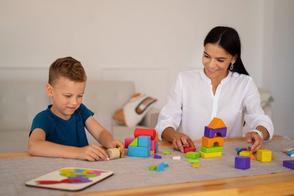 Therapist with boy during session