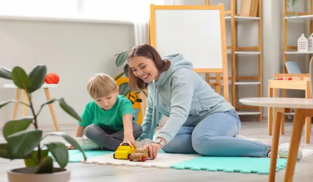 Parent playing with child on the floor