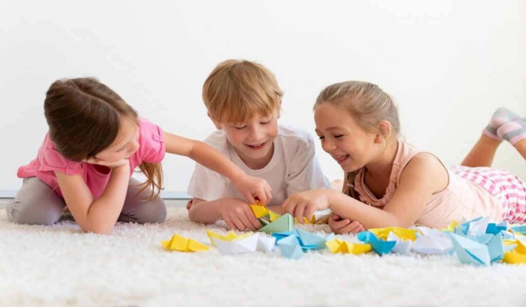 Children playing with origami boats