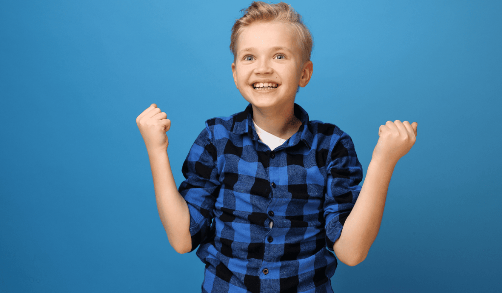 Triumphant boy