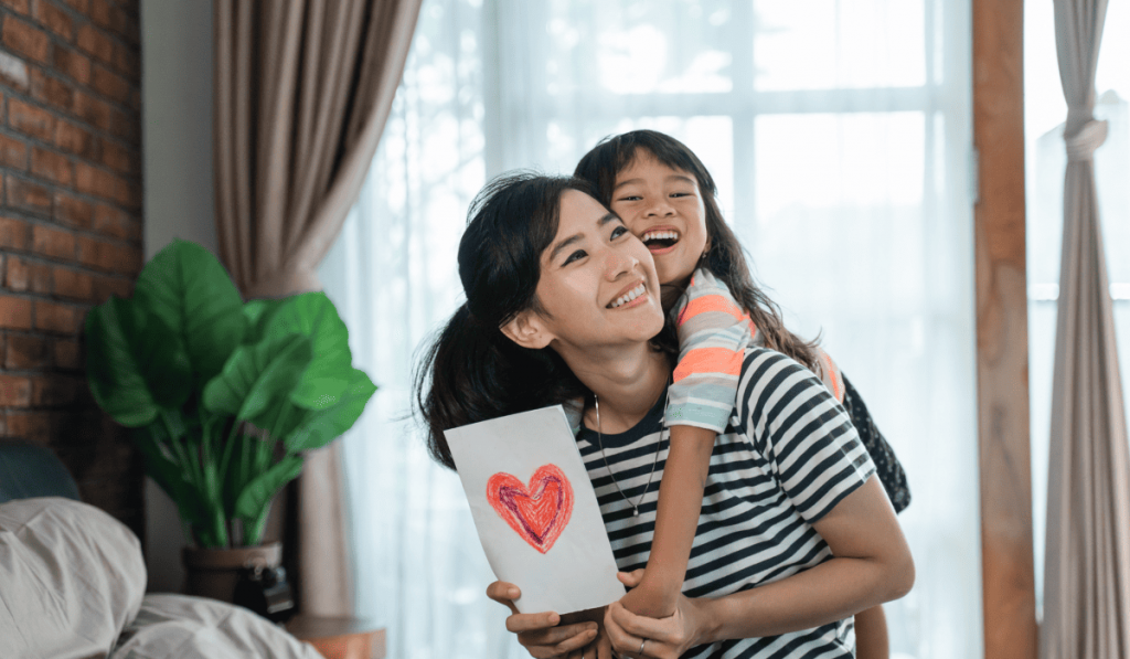 Mother and child smiling together