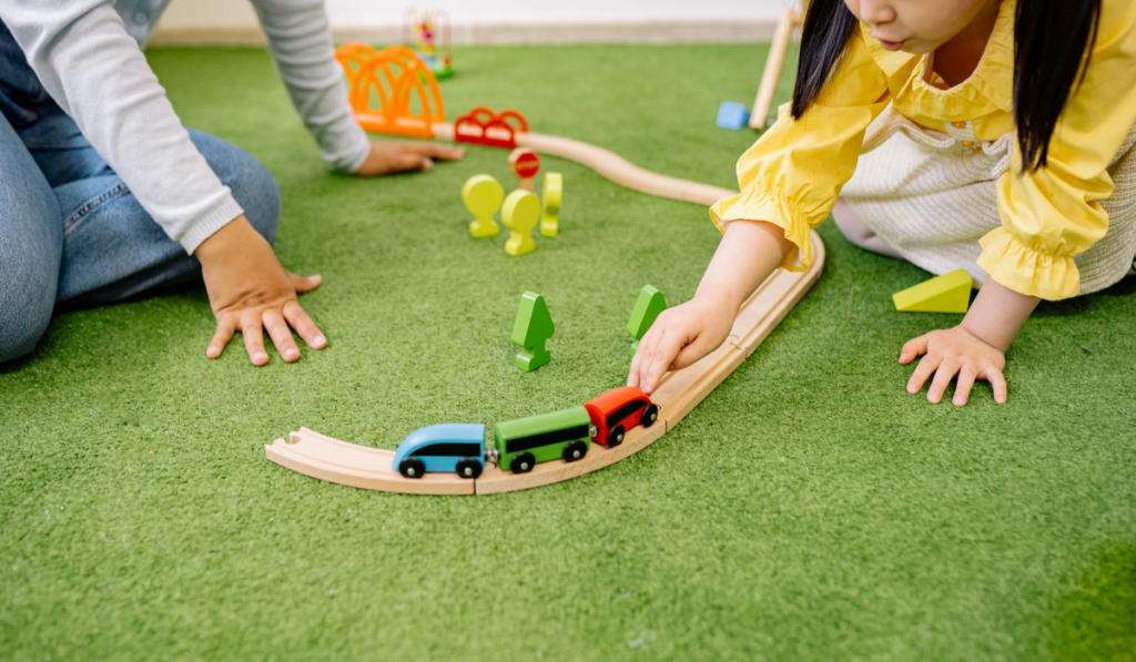 Children playing with train set