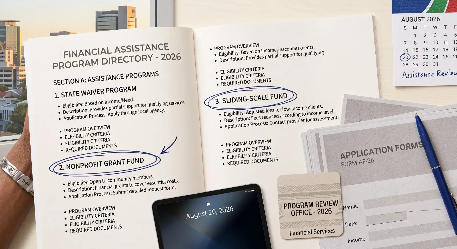 A printed directory of financial assistance programs with two entries circled in pen rests beside a short stack of application forms, in a clean flat-lay composition.